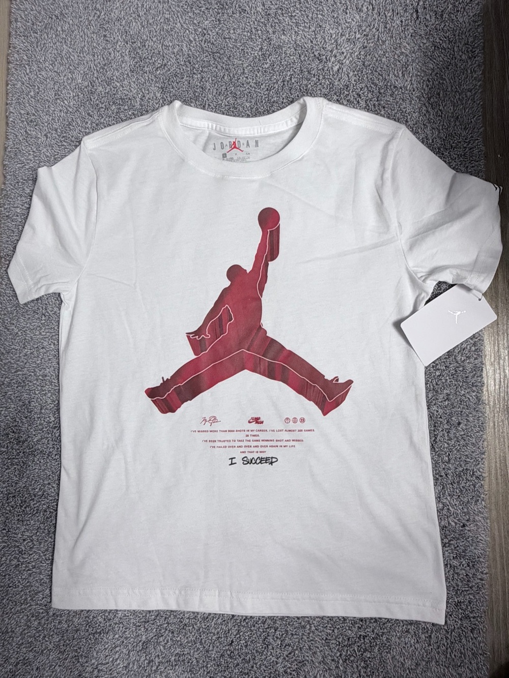 Jordan White Short Sleeve Tee with Red Jumpman Graphic Small (8-10years)